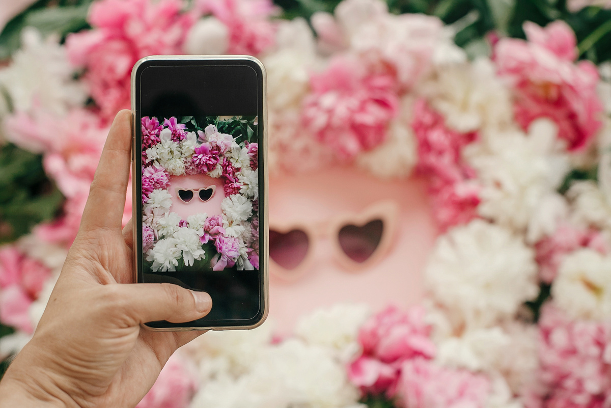 Instagram Blogging Concept. Hand Holding Phone and Taking Photo